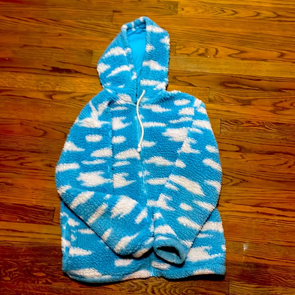 Zip up sweater that has the clouds and the sky detailed on it!